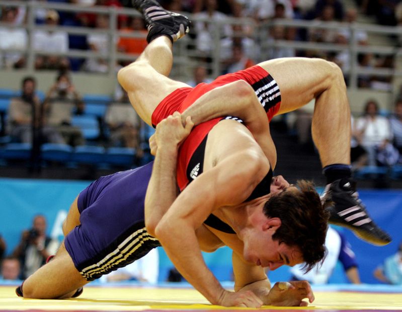Switzerland's Bucher grapples Russia's Samourgachev during Greco-Roman wrestling at Athens 2004 Olympic Games